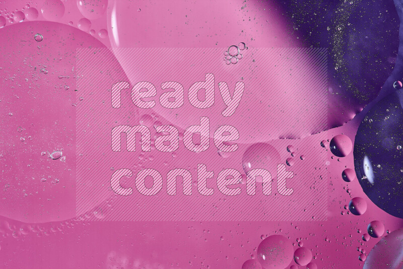 Close-ups of abstract oil bubbles on water surface in shades of purple and pink