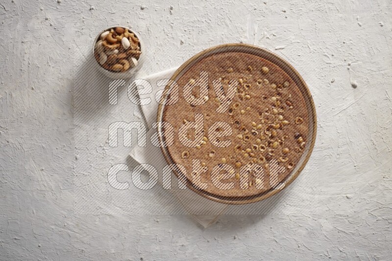 Basbousa with nuts in a light setup