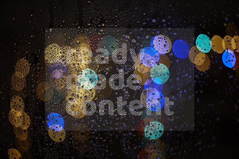 Bokeh light in multicolor with water drops