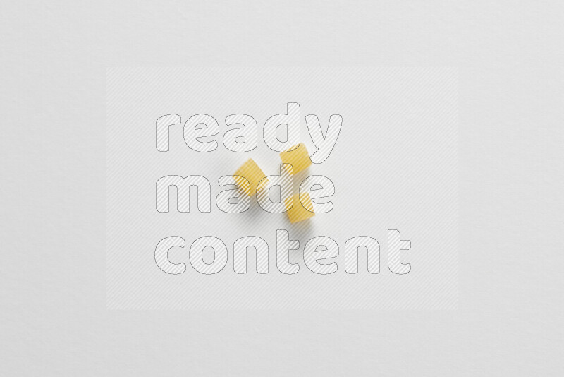 Small rings pasta on white background