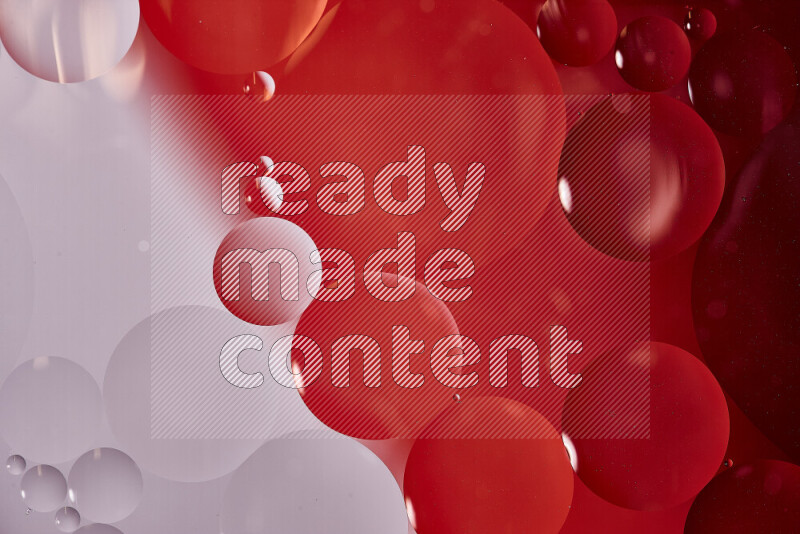 Close-ups of abstract oil bubbles on water surface in shades of white and red