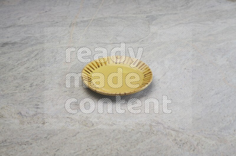 Multicolored Pottery Plate On Grey Marble Flooring