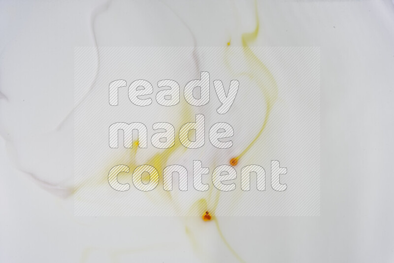 A close-up of abstract swirling patterns in yellow and white