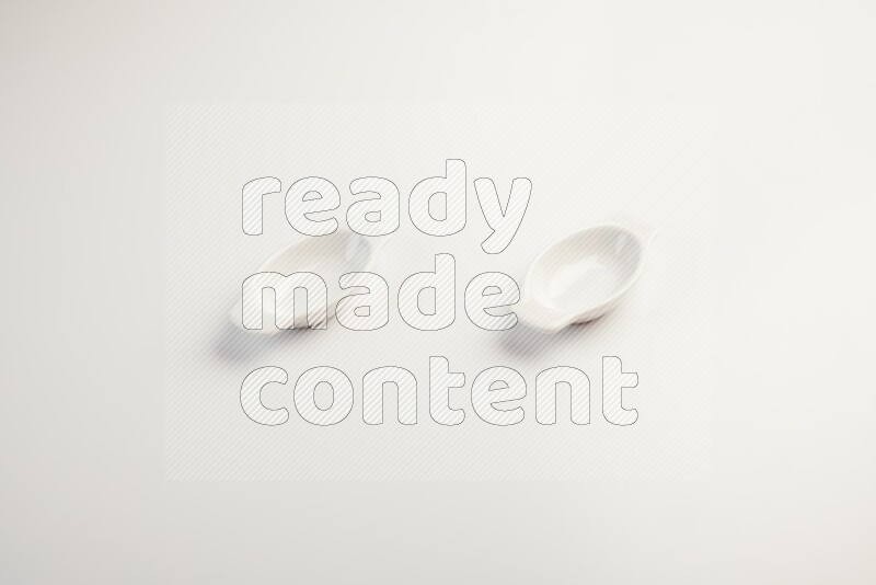 white ceramic oval sauce dish on white countertop