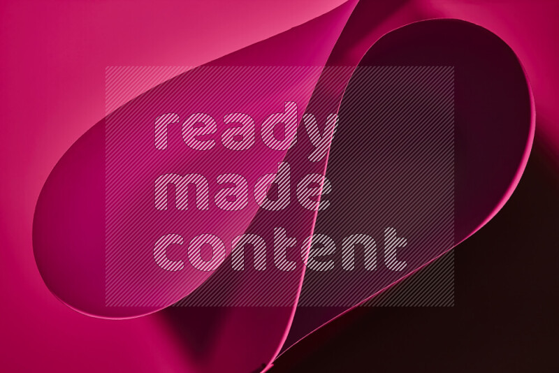 An abstract art of paper folded into smooth curves in pink gradients