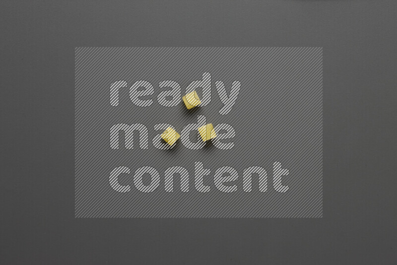 Small rings pasta on grey background