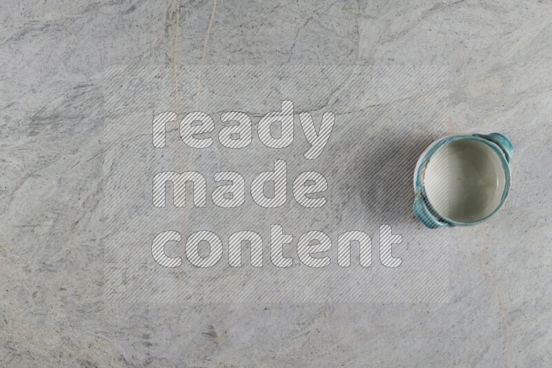 A multicolored pottery Bowl on grey marble background