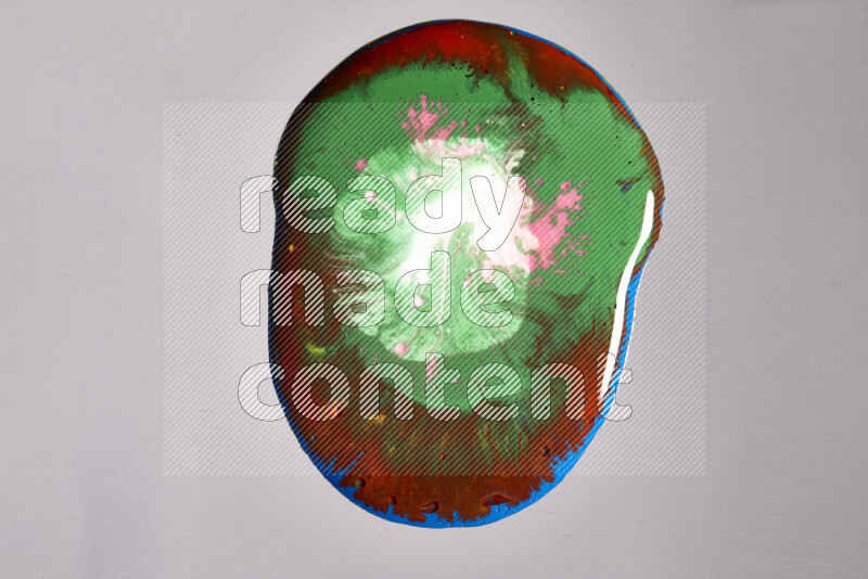 Close-ups of assorted colors blending on a grey background