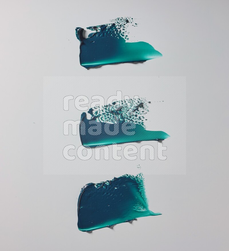 Turquoise painting knife strokes in on white background