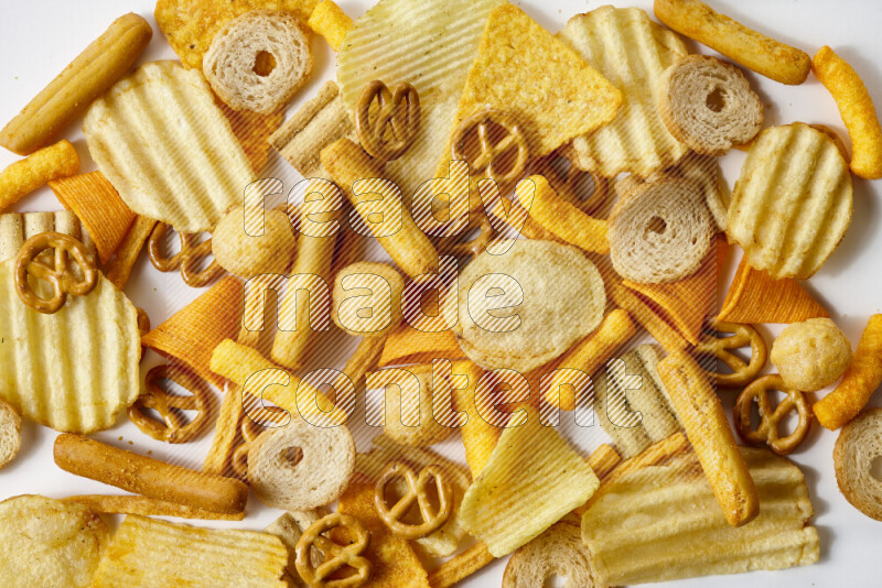 Assorted snacks on white background