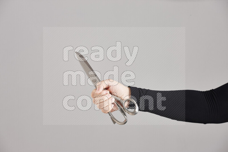Woman hands holding different metal essentials in different positions