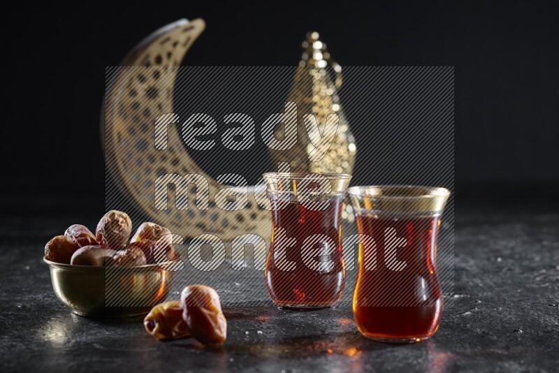 Dates with hot drinks and golden lanterns in a dark setup