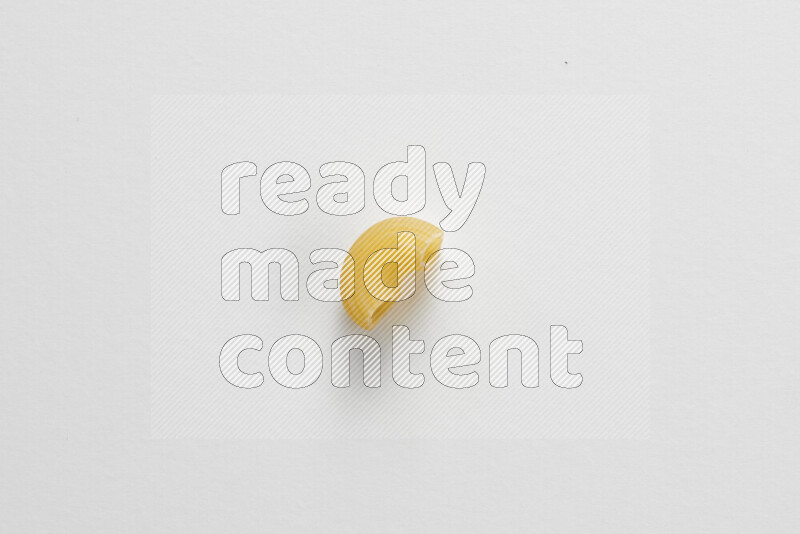 Elbow pasta on white background