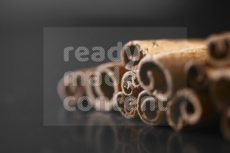 Cinnamon sticks on black background
