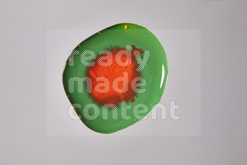 Close-ups of assorted colors blending on a grey background