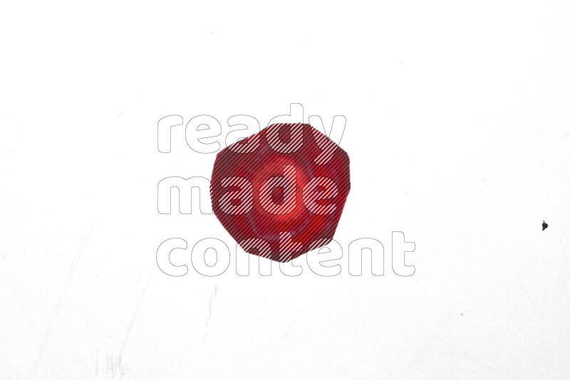 Beet slices on illuminated white background