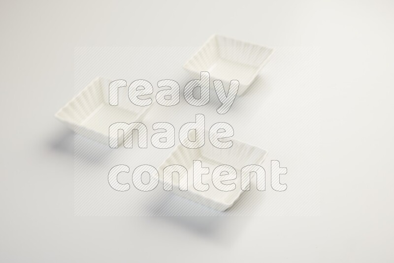 white ceramic square sauce dish on white countertop