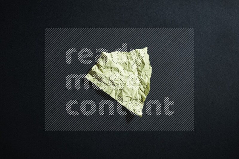 Yellow paper sheet on black background