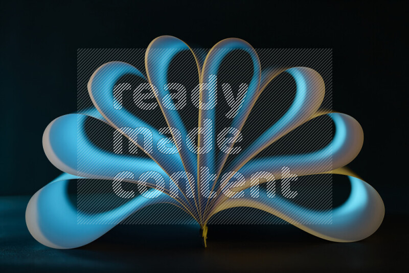 An abstract art piece displaying smooth curves in blue gradients created by colored light