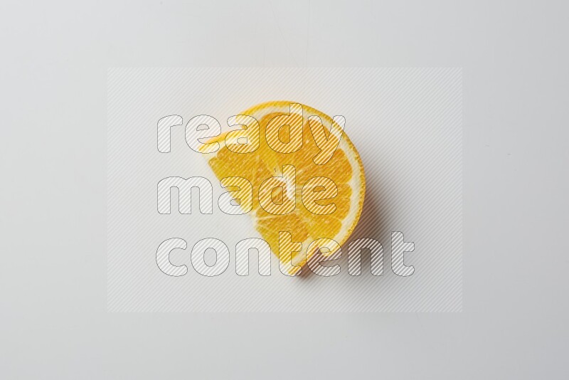 Two halves of an orange slices on white background