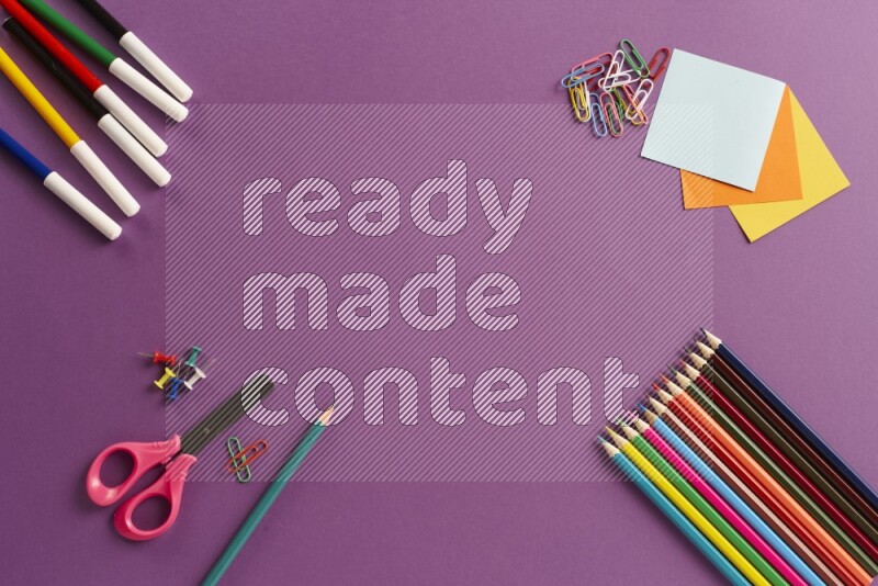 Different school supplies on purple background