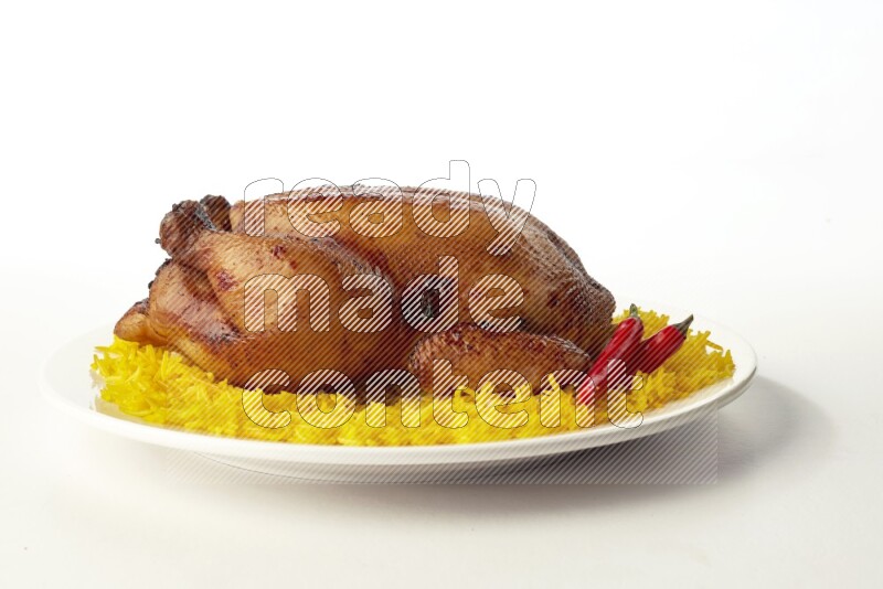 yellow  basmati Rice with  whole roasted chicken on a white rounded plate direct on white background