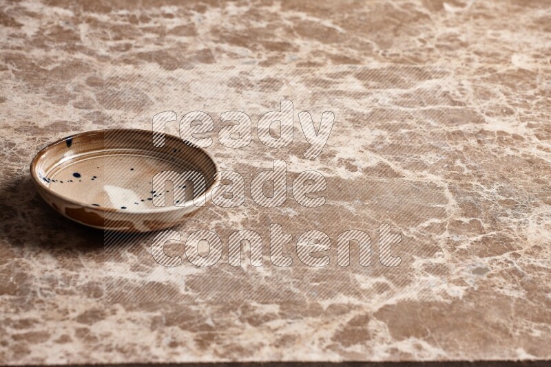 Multicolored Pottery Bowl on Beige Marble Flooring