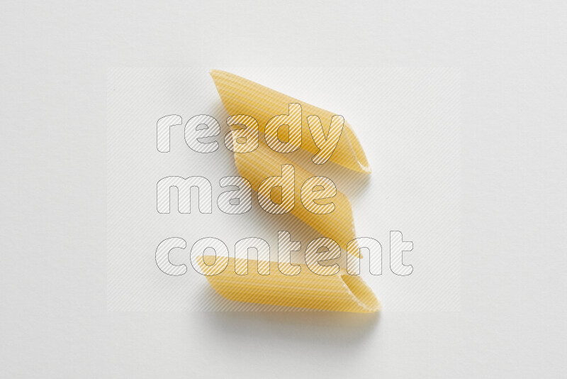 Penne pasta on white background