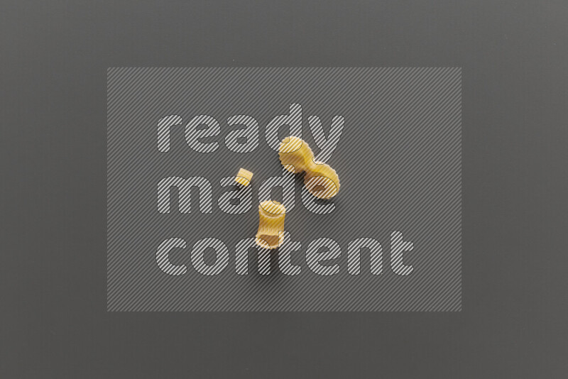 Different pasta types on grey background