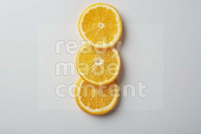 Three orange slices on a white background
