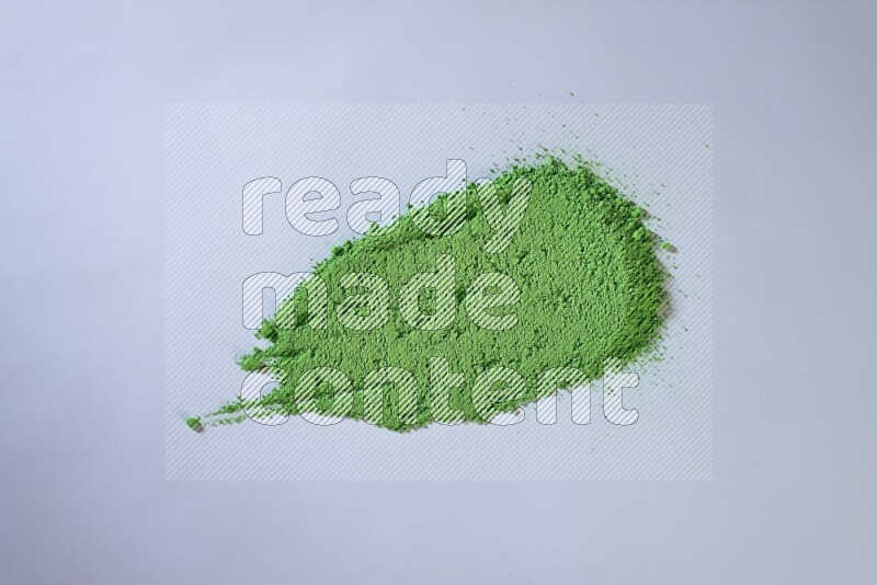 Green powder smears on white background