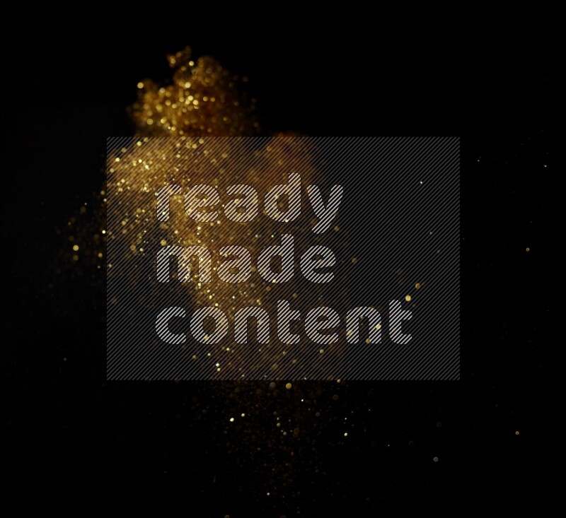 Gold glitter powder isolated on black background