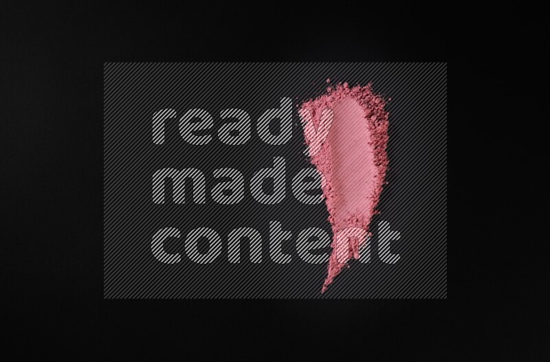 أشكال من المسحوق الأحمر علي خلفية سوداء