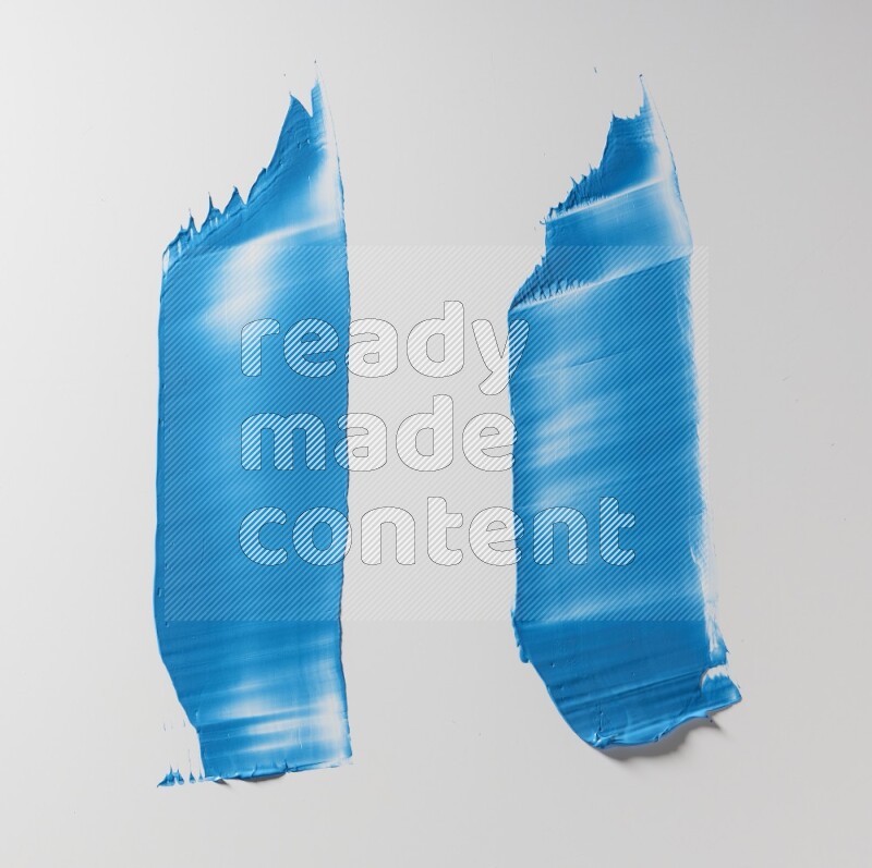 Blue painting knife strokes on white background