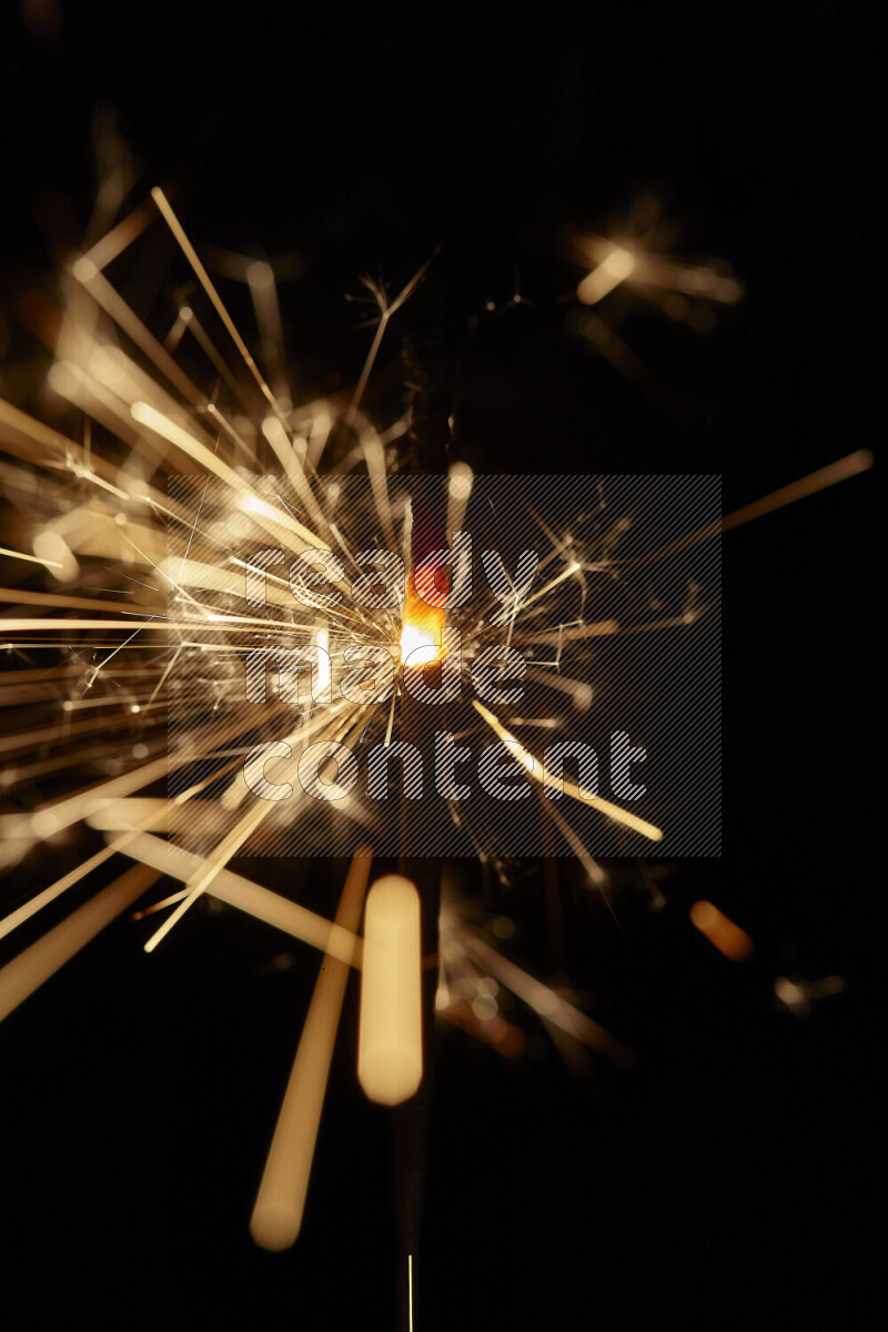 A close-up image of sparkler candle isolated on black background