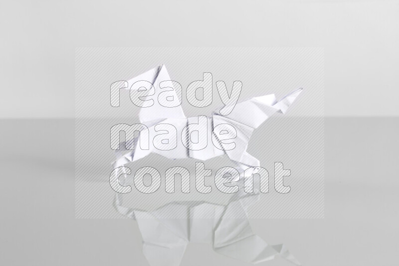 Origami animals on grey background