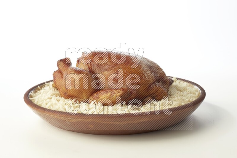 white  basmati Rice with  whole roasted chicken    on a pottery plate  direct  on white background