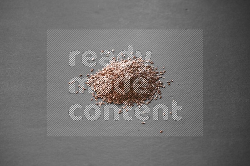 Flax seeds on a black flooring