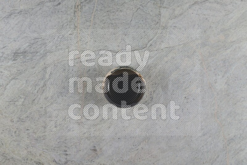 A multicolored pottery Bowl on grey marble background
