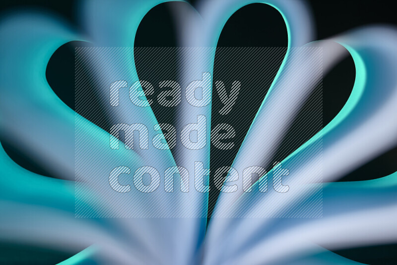 An abstract art piece displaying smooth curves in white and blue gradients created by colored light