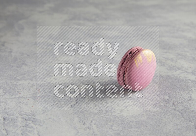 45º Shot of Purple Strawberry macaron on white  marble background