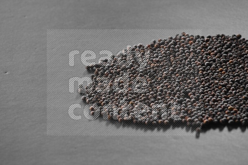 Black pepper on a black flooring