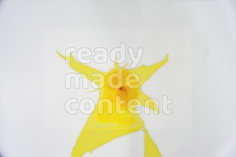 A close-up of abstract swirling patterns in yellow and white