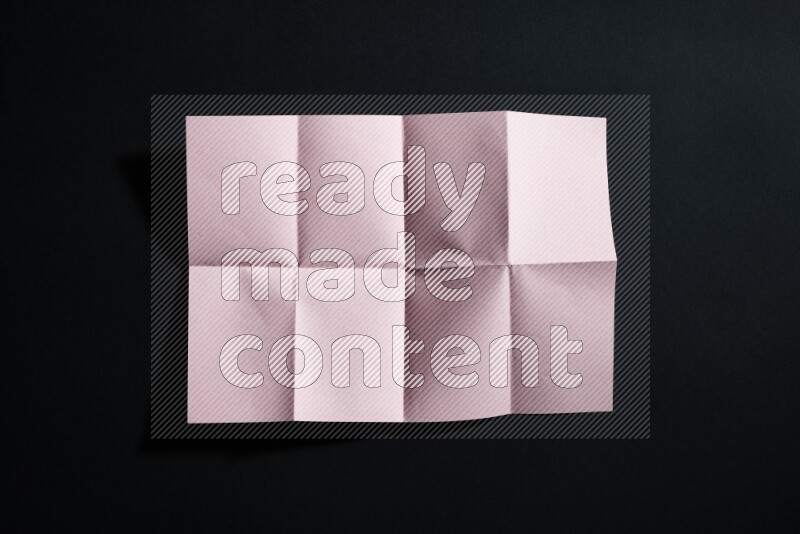 Pink paper sheet on black background