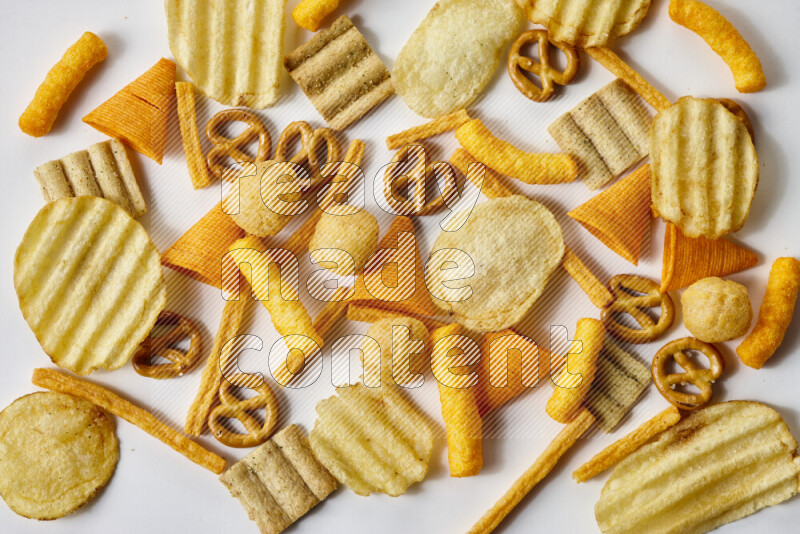 Assorted snacks on white background