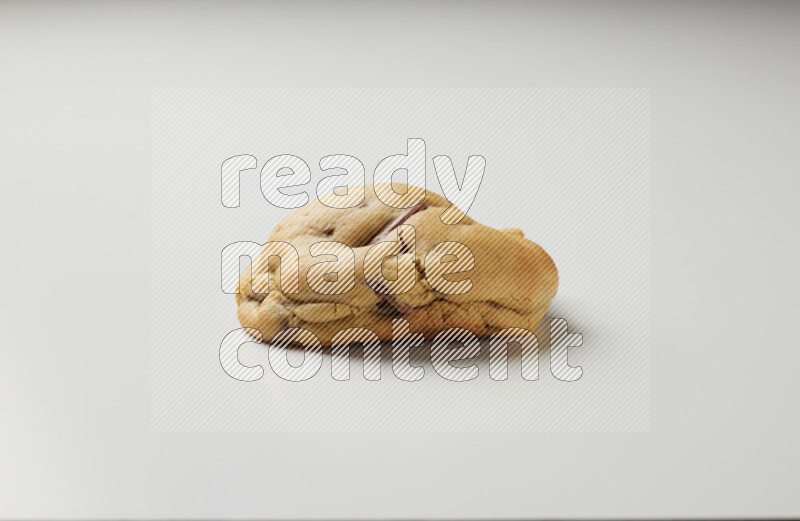 a chocolate chip cookie on a white background