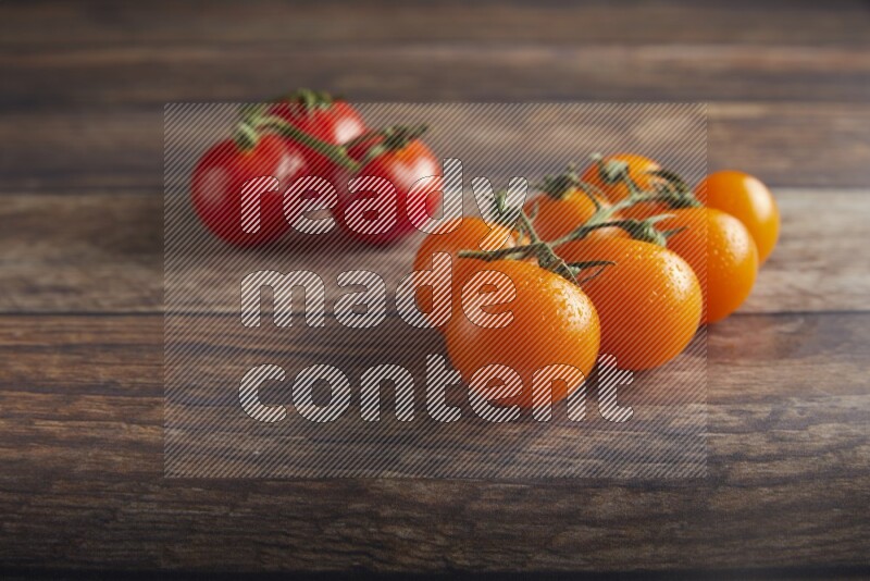Mixed cherry tomato veins on a textured wooden background 45 degree