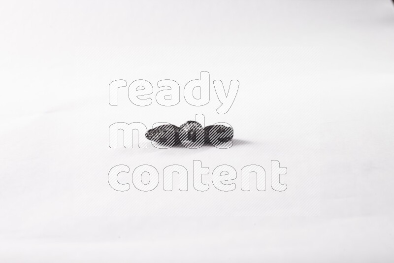 Dried plums on white background