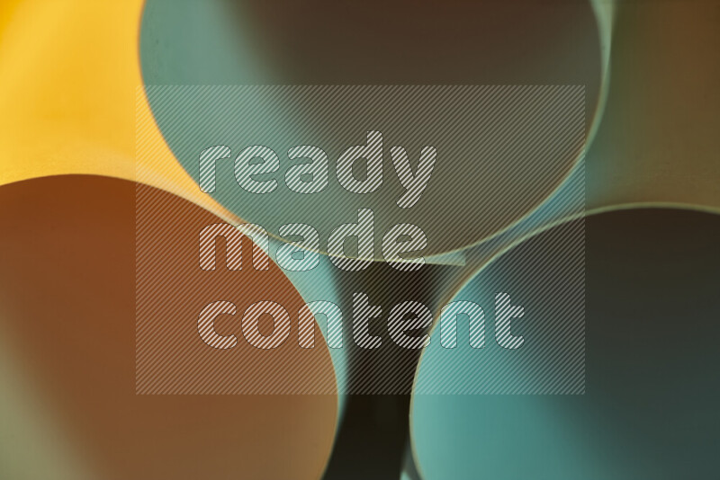 The image shows an abstract paper art with circular shapes in varying shades of green and warm tones