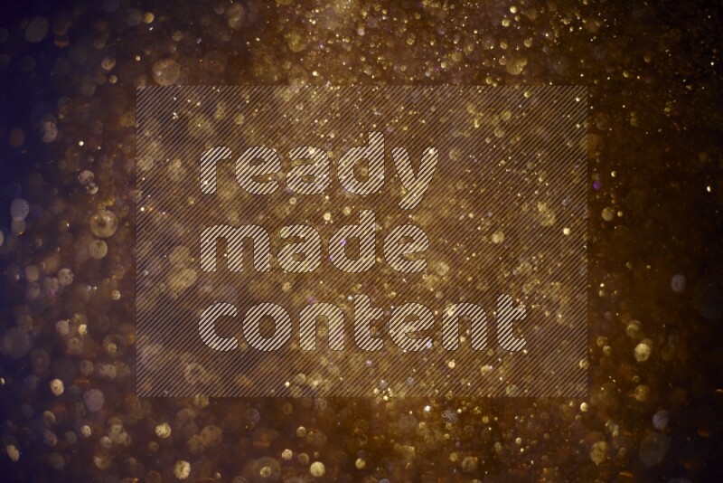 Gold glitter powder isolated on black background